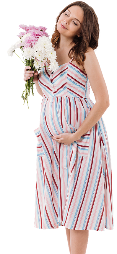 cheerful pregnant woman holding flowers with eyes closed 1